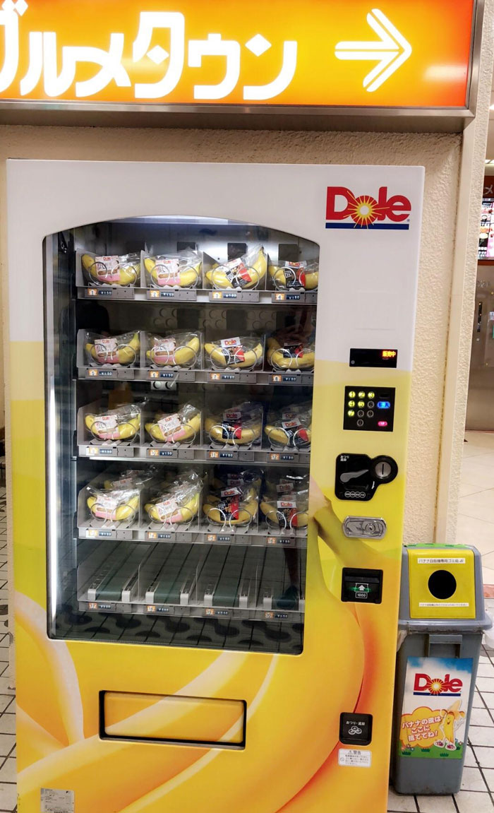 A Banana Vending Machine In An Underground Subway Station In Tokyo. The Trash Can To The Right Is For Only The Plastic Wrappers And Banana Peels