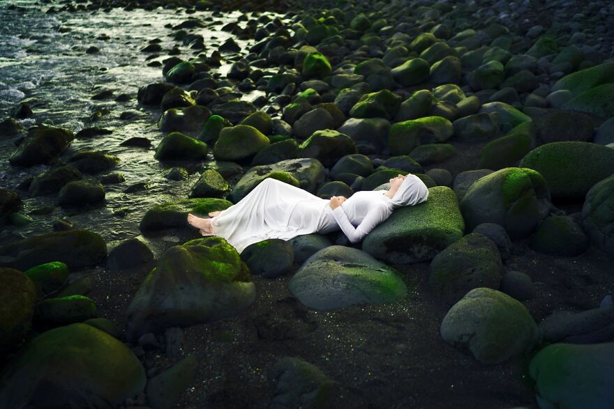 She Finally Was Able To Rest On A Bed Of Rocks, Listening To The Sound Of The Waves. The Green Moss Comforted Her Skin, While Tiny Raindrops Of Water Besprinkled Her Feet. It Was Here She Found Herself Closer To A Home