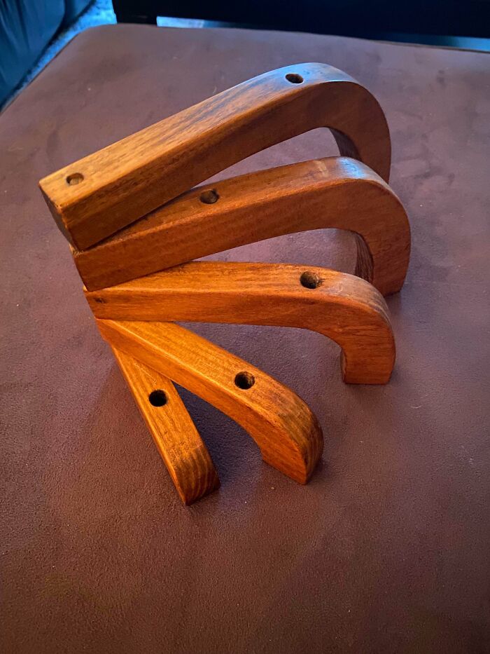 Modular Curved Wooden Pieces With Two 1/2" Holes In Each Segment. Only One Hole In Each Segment Goes Completely Through The Wood For A Simple Wooden Dowel To Keep It All Together. The Other Hole Only Goes Halfway. Bought At Thrift Shop