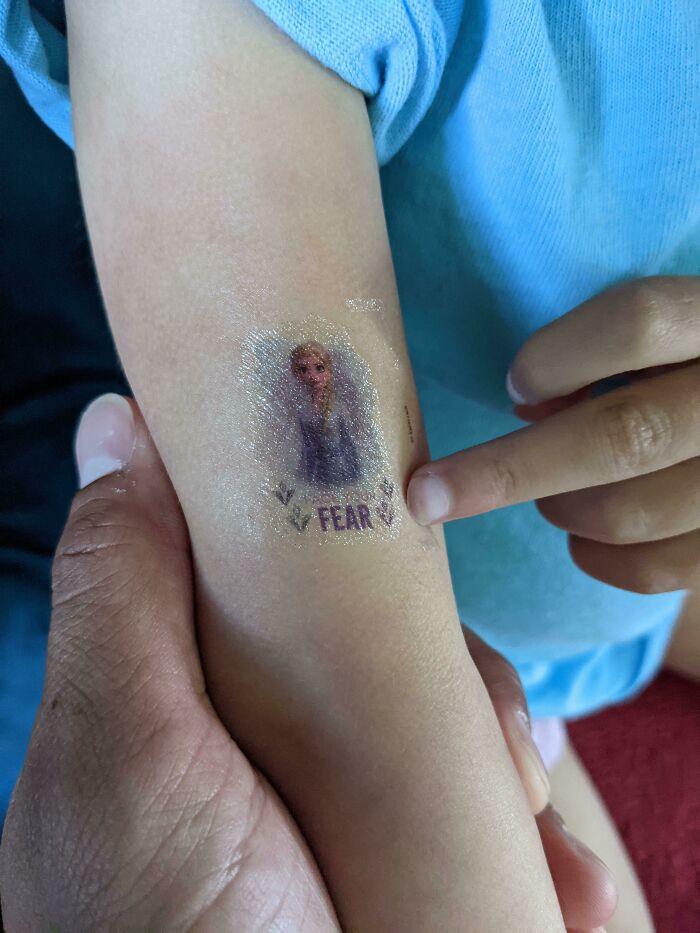 This Frozen 2 Temporary Tattoo Is Supposed To Say "Face Your Fear", But The First Two Words Are Written In An Orange-Ish Color
