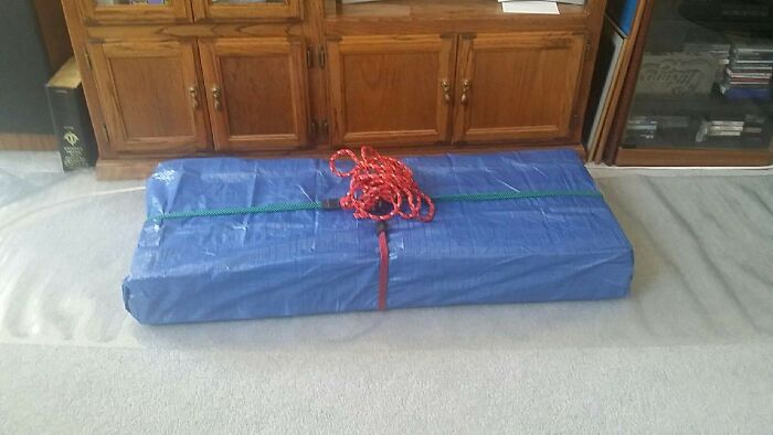 The Tool Set Gift I Got My Dad For Father's Day Was Heavy And Awkward To Wrap Traditionally, So I Bought A Small Tarp And A Pack Of Colorful Bungee Cords To Act As Gift Wrap And Ribbon! Practical And Only Cost Me $10!