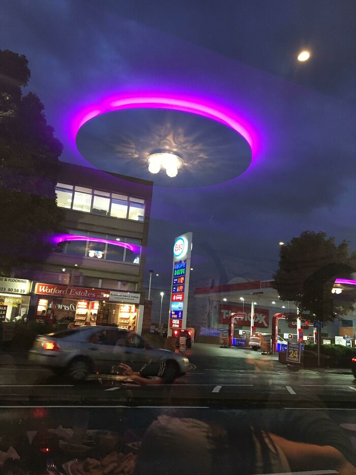 Our Restaurant's Lights Reflected Off Their Window Looks Like The Aliens Have Arrived