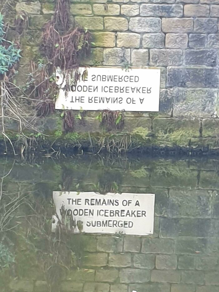 This Sign Was Designed To Be Read In The Reflection Of The Water