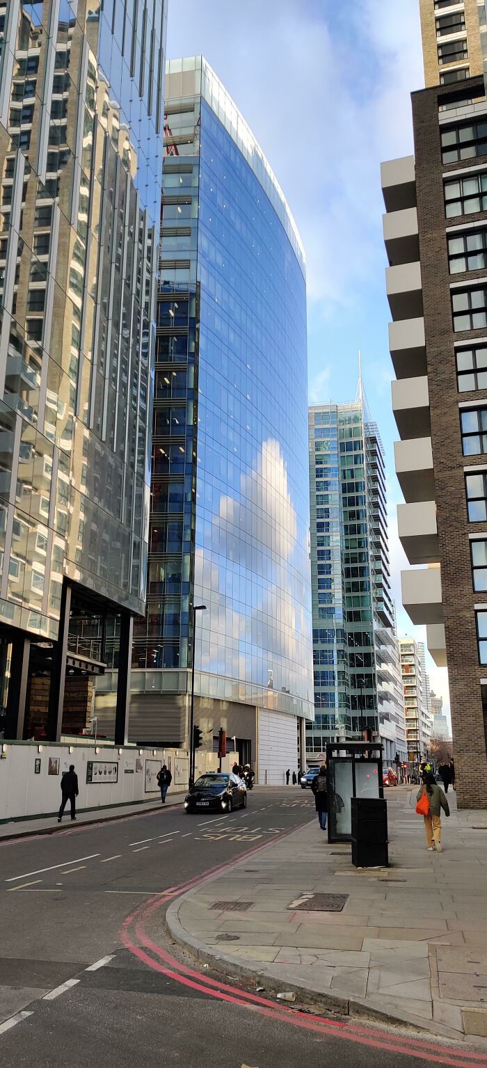 The Clouds Reflected Off This Building Look Pixelated