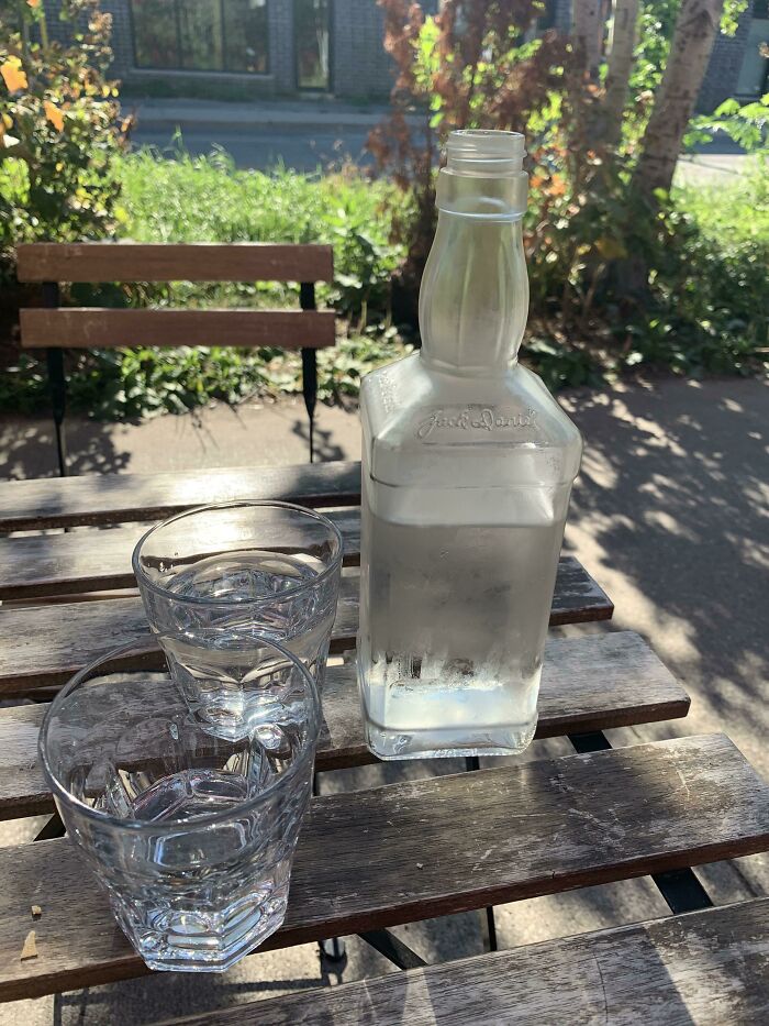 Using Old Liquor Bottles To Serve Water At Restaurants