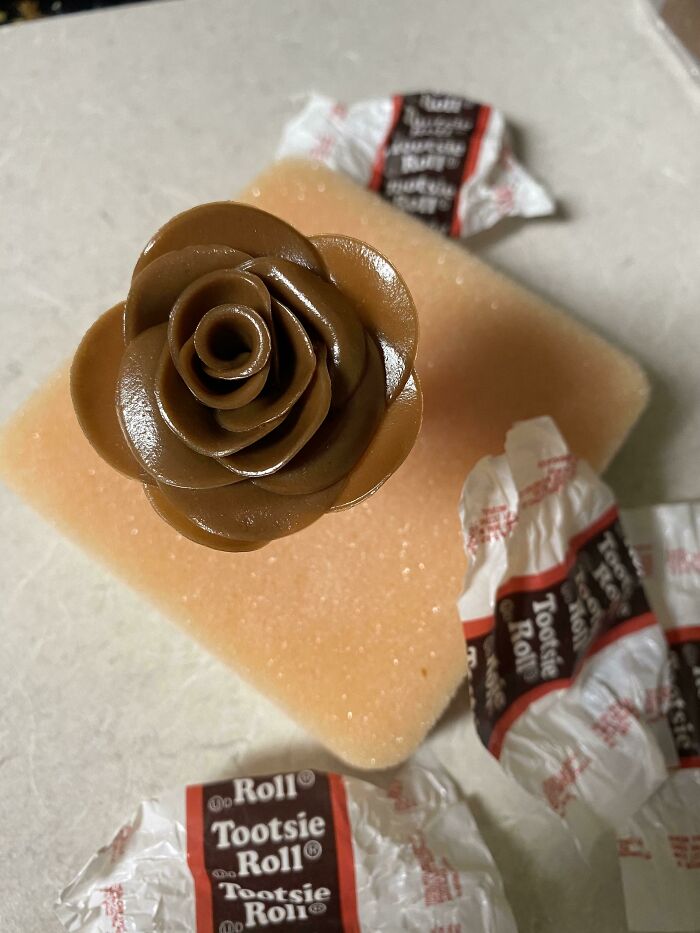 I’ve Been Furloughed Since March And I Found A Small Shop Hiring So For Their Interview They Require You Bring In Something To Showcase Your Work. I’ve Started With A Tootsie Roll Rose That Will Go With A Chocolate Butterfly On Cheesecake, What Do Y’all Think??