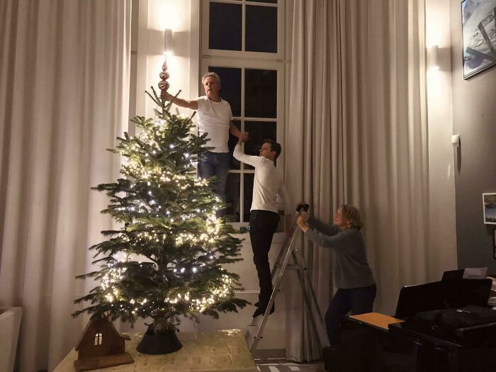 My Family Setting Up The Christmas Tree