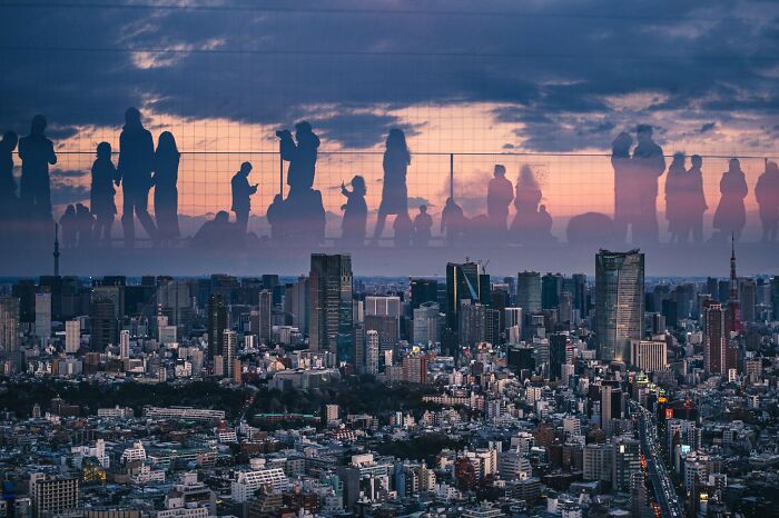 Glass Reflection Makes It Look Like There Are People In The Sky Of Tokyo