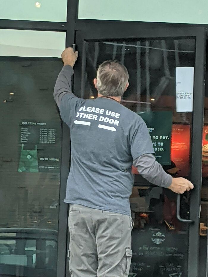 Maintenance Guy's Shirt Doubles As A Helpful Sign