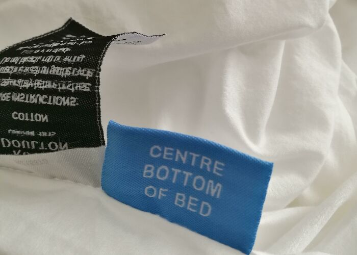 Bed Sheet Tells You Which Side You Are Holding So That You Can Orientate It When Putting It On The Bed