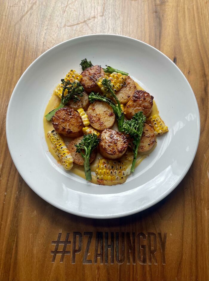 Seared Scallops With ‘Nduja Butter, Grilled Corn, Charred Broccolini, New English Potatoes, Brown Butter Corn Purée.