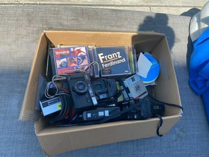 “A Box Of Emo Cds And Old Cameras” Outside Of 268 St Nick