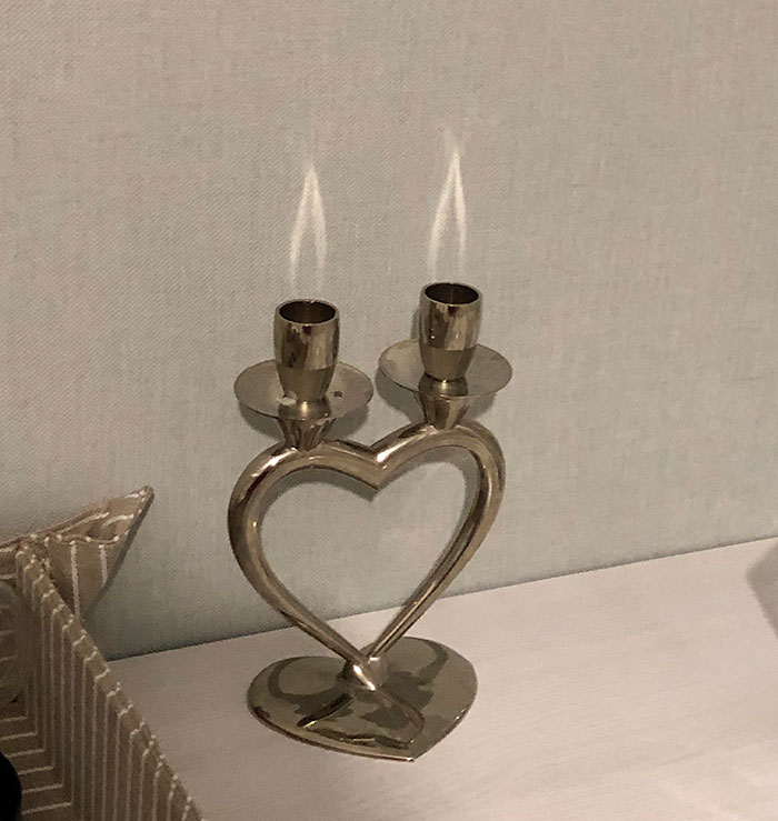 The Light Reflected Off These Candle Holders Look Like Flames