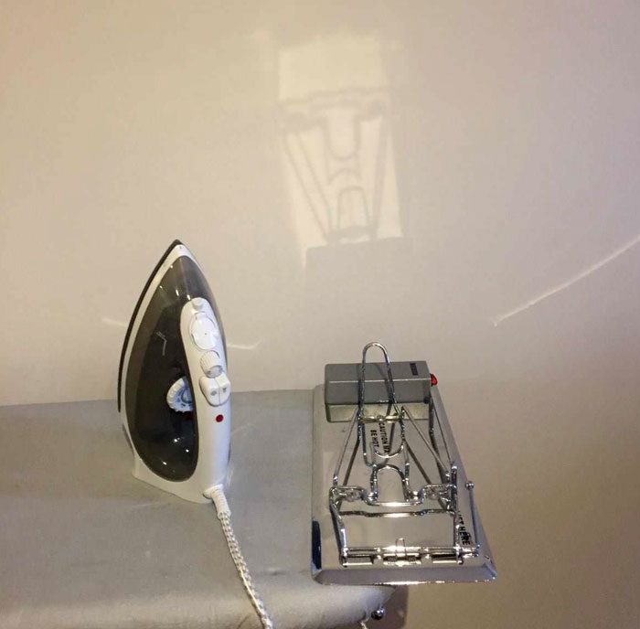 The Reflection From The Ironing Board In My Hotel Room Looks Like A Transformer
