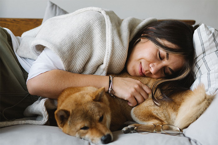 Here’s Why You Should let Your Dog Sleep In Your Bed