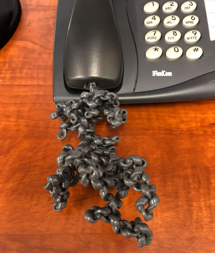 Had To Use My Coworkers Office Today Who Is On Vacation To Make Some Phone Calls. This Is What His Phone Cord Looks Like