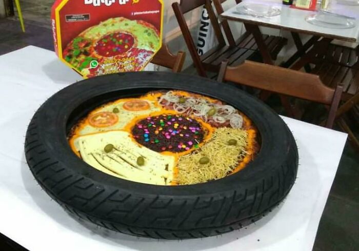 Multi-Flavor Pizza Served In A Tire