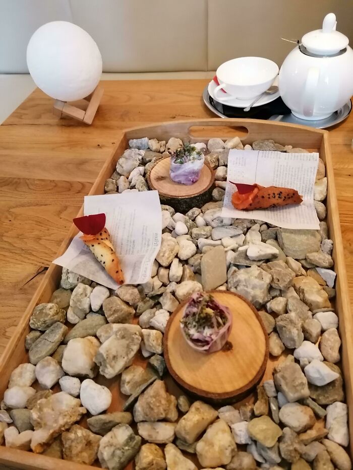 We Got Appetizers Served On A Tray Full Of Stones