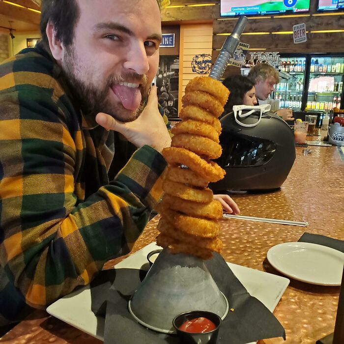 Onion Rings Served On An Oil Funnel
