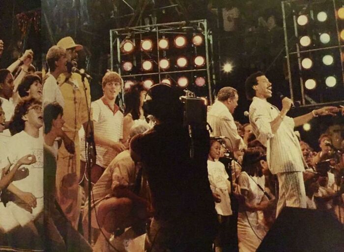My Dad Snuck Onto Stage After Tailgating All Day Without A Ticket For The Singing Of ‘We Are The World’ At Live Aid Philadelphia In 1985 (In The Red Collared Golf Shirt)
