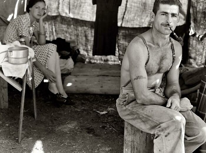 Unemployed Lumber Worker Goes With His Wife To The Bean Harvest. Note Social Security Number Tattooed On His Arm. Oregon, August 1939