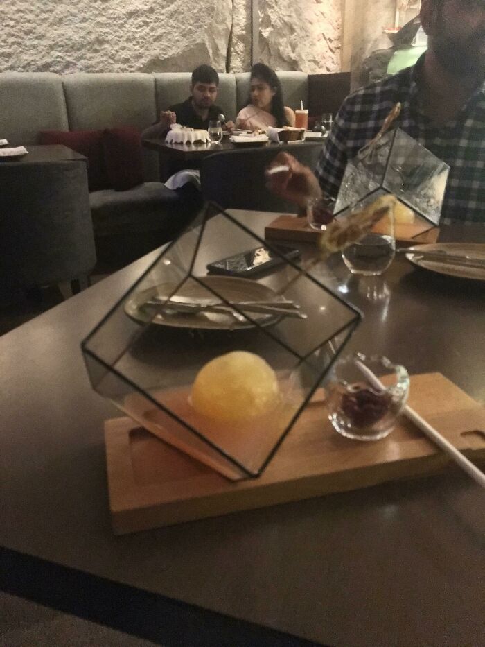 Our Cocktails Were Served In Inverted And Out Of Shape Fish Tanks