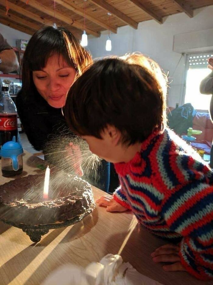 Kid Spitting All Over The Cake
