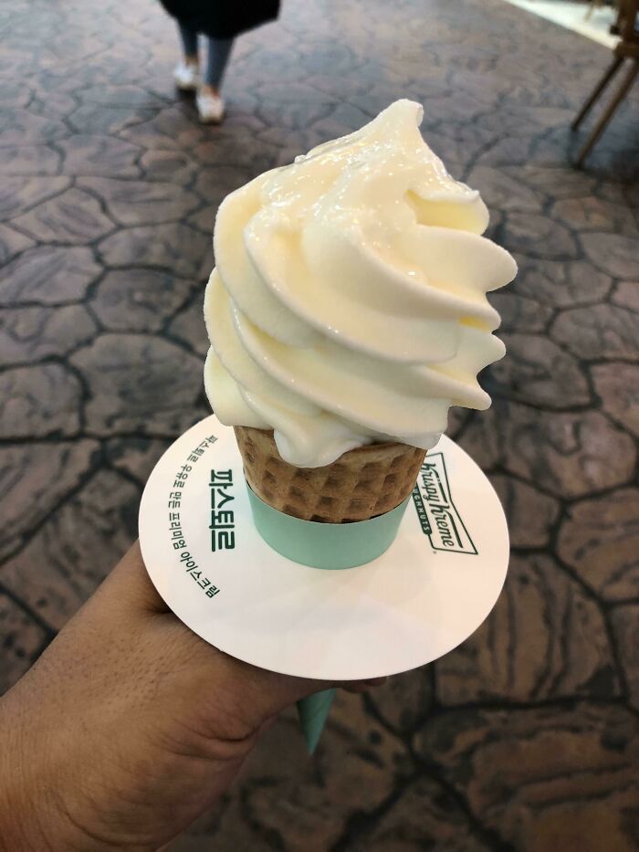 Krispy Kreme In Korea Where They Sell Milk Flavored Ice Cream Cone With A Drip Cover