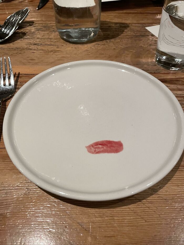 These Plates With A Painted On Lipstick Smudge