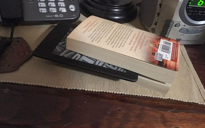 My Dad Likes Reading So I Got Him A Kindle For His Birthday. He's Using It As A Bookmark