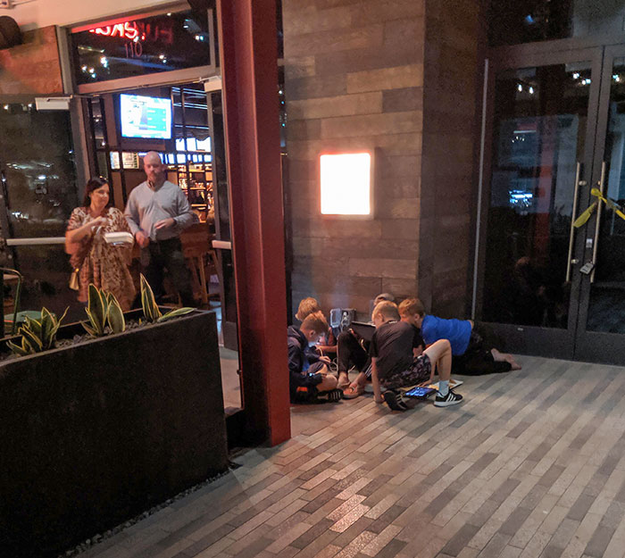 Entitled SoCal Moms Paying No Attention To Their Barefoot Children Crowding The Entrance To A Nice Restaurant