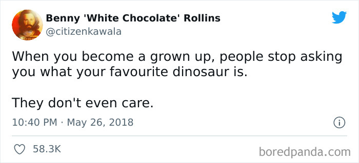 Tweet about adulthood humorously highlighting loss of interest in dinosaurs.