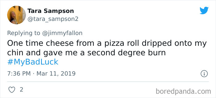 Tweet sharing a funny bad luck moment where cheese from a pizza roll caused a second degree burn on the chin.