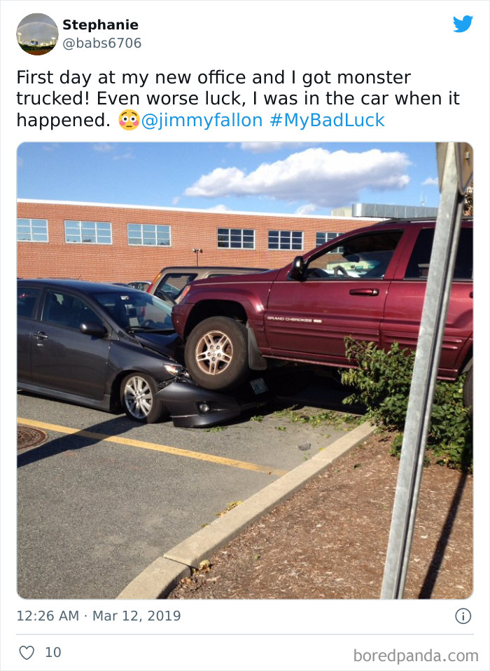 Car accident showing bad luck moment with a red SUV partially on top of a black car in a parking lot.