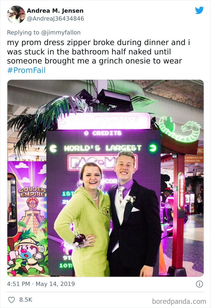 Young couple at arcade, girl wearing green onesie after prom dress zipper broke, illustrating funny bad luck moments.