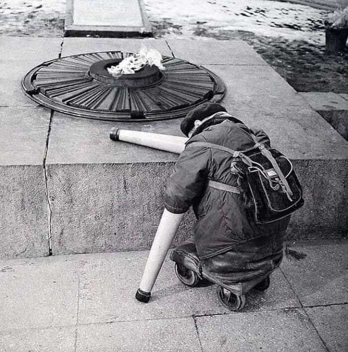 Moloch Of War (1966). Photo Of A Soviet War Veteran Near The Eternal Flame On The Anniversary Of Victory Day