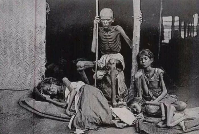 Historical photo depicting famine victims, showing extreme malnutrition and hardship.