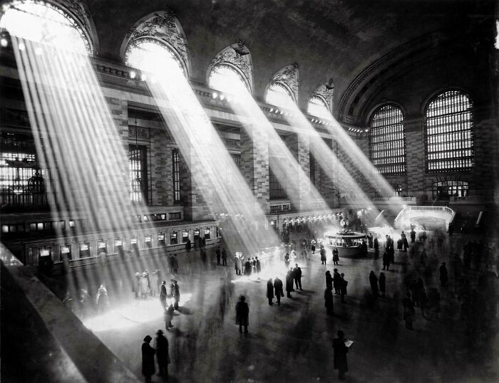 Grand Central Terminal with sunlight beams streaming through windows, capturing an important historical moment.