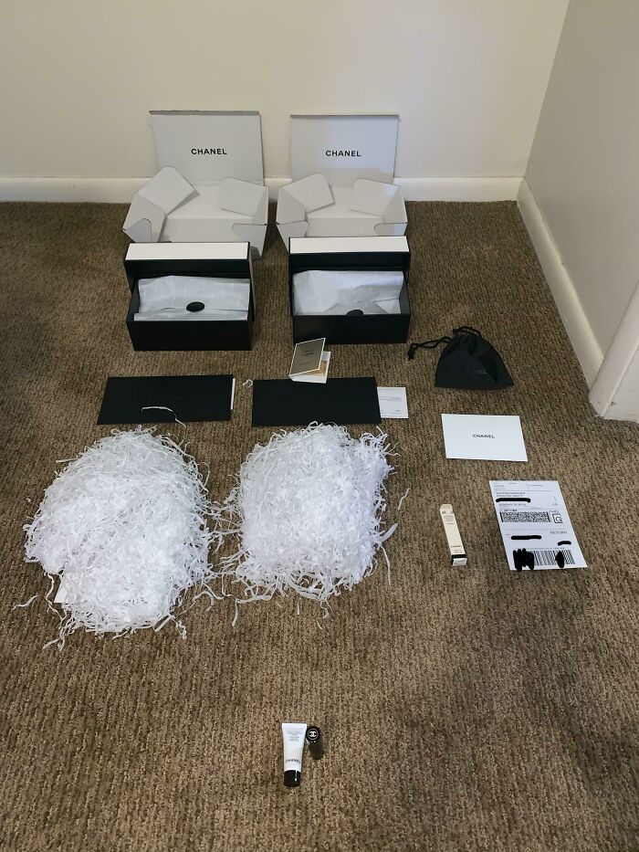 Empty Chanel packaging and excessive shredded paper on carpet illustrating funny takes on anti-consumption in an online community.