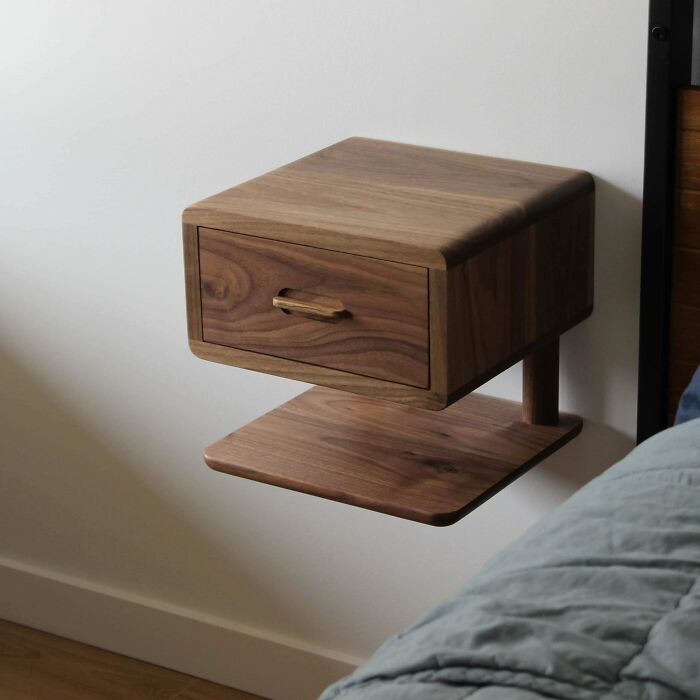 Floating wooden bedside drawer and shelf with smooth finish showcasing expert woodworking craftsmanship.