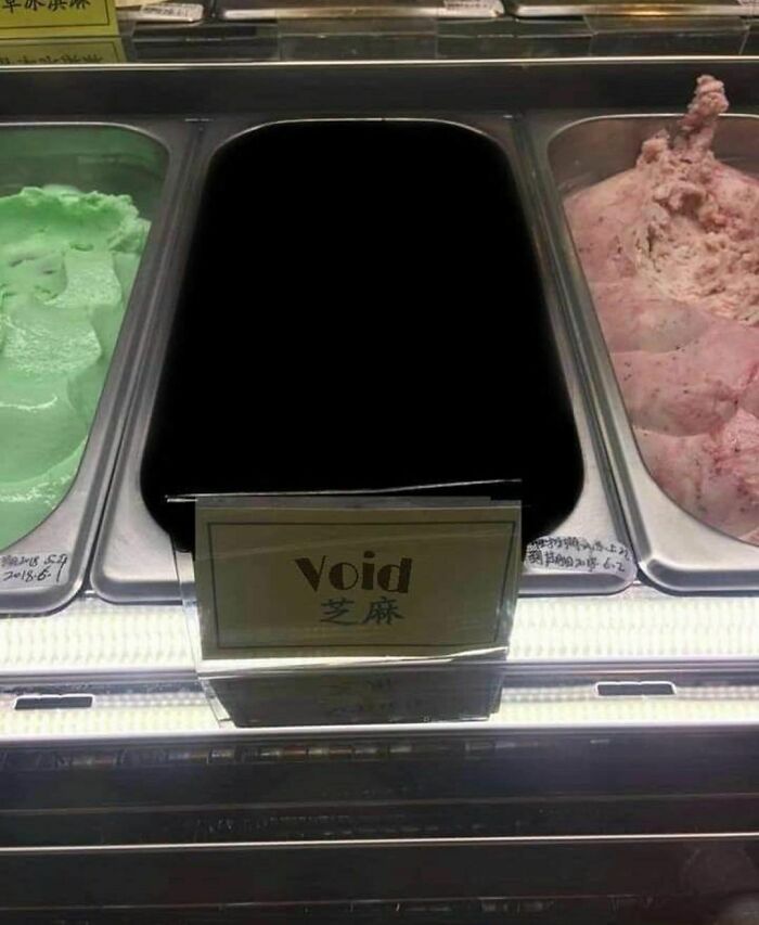 Ice cream display with a black void flavor, showcasing one of the weirdest Instagram account pictures.