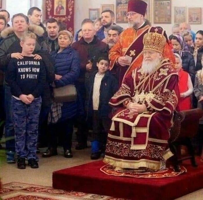 Crowd gathered in a church with a boy wearing a California knows how to party shirt, a weird Instagram account moment.