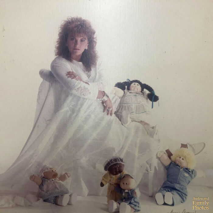 This Was My Senior Picture And My Mom Thought It Would Be A Great Idea To Pose With Some Of My Cabbage Patch Collection Of Dolls. For Some Reason, I Decided To Go With The Sultry Look. The Rest Is History As You Can See