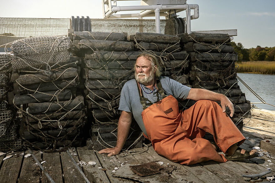 Oyster Man On Dock After A Day Of Farming By Nicola Ducati