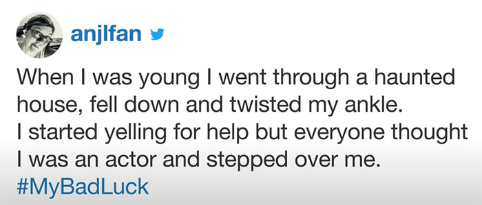 Tweet about a bad luck moment involving a twisted ankle in a haunted house, shared with hashtag MyBadLuck.