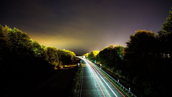 While Taking A Long Exposure Photo From A Bridge A Car Drove By
