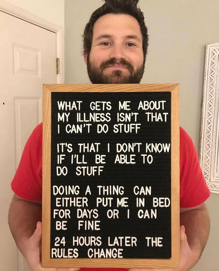 Man holding board with message about unpredictability of chronic illness on Instagram account spreading awareness