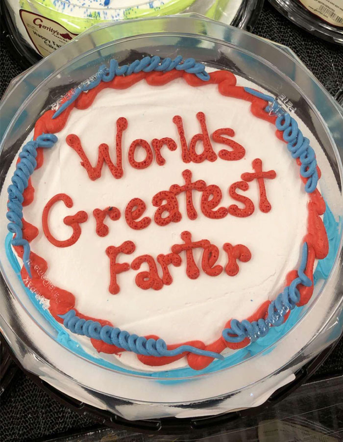 Cake fail with icing text reading "World's Greatest Farter" in red, surrounded by blue and red borders.