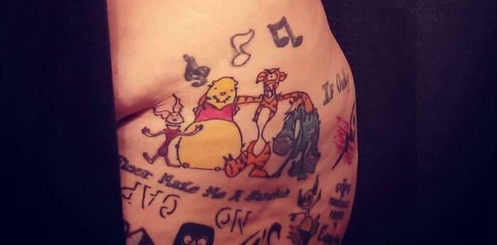 Bad tattoos featuring poorly drawn cartoon characters and random musical notes.