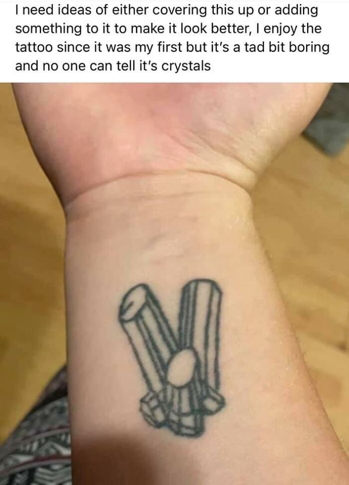 Poorly designed crystal tattoo on a wrist needing improvement ideas.